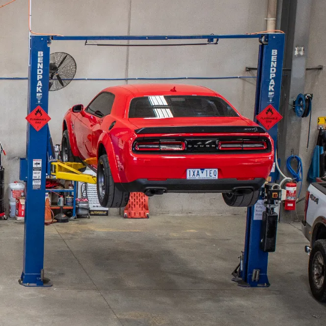 autogroup service centre dodge challenger on hoist