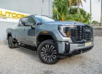 Grey GMC pickup truck at dealership