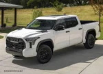 White Toyota pickup truck parked on driveway