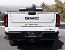 Right hand drive 2026 GMC Sierra 1500 AT4X in Summit White from Autogroup International in Australia (side)
