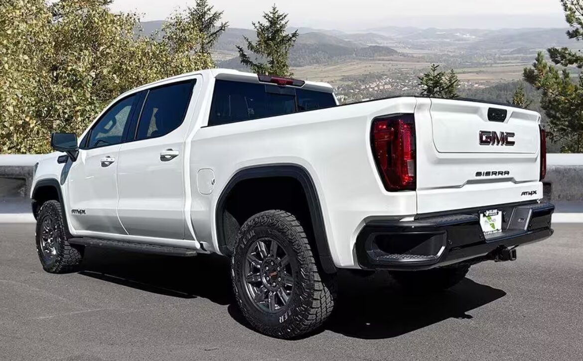 Right hand drive 2026 GMC Sierra 1500 AT4X in Summit White from Autogroup International in Australia (side)