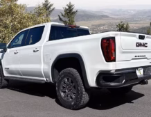 Right hand drive 2026 GMC Sierra 1500 AT4X in Summit White from Autogroup International in Australia (side)