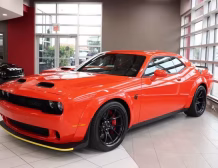 2023 Dodge Challenger SRT Hellcat Redeye Widebody in Go Mango by Autogroup International - ready for right hand drive conversion
