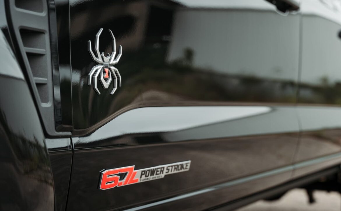Right hand drive Black Widow F-250 Lariat Pickup truck from Autogroup International in Australia with powered side steps