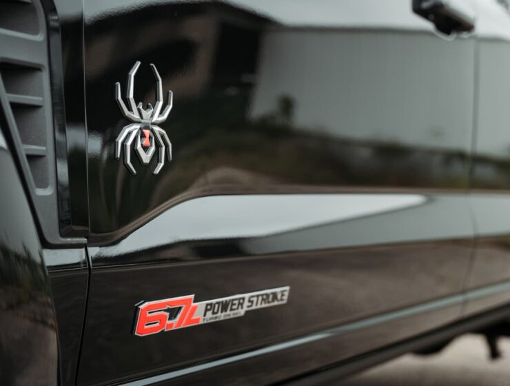 Right hand drive Black Widow F-250 Lariat Pickup truck from Autogroup International in Australia with powered side steps
