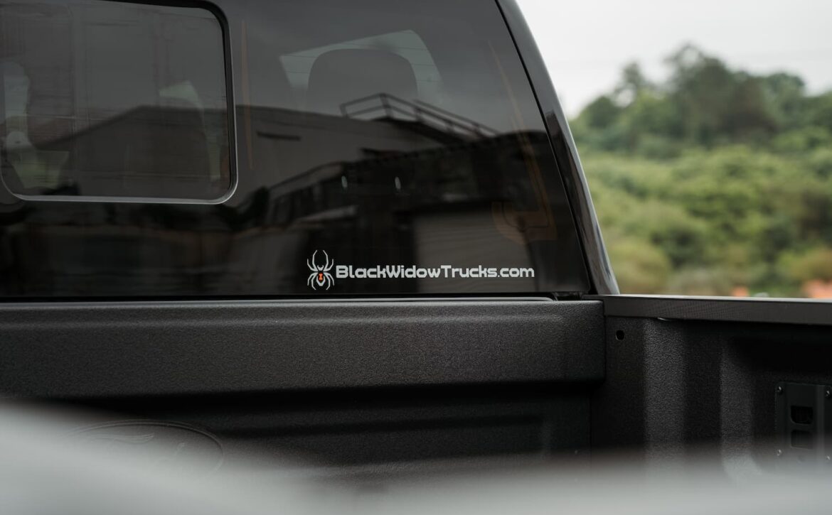 Right hand drive Black Widow F-250 Lariat Pickup truck from Autogroup International in Australia with powered side steps