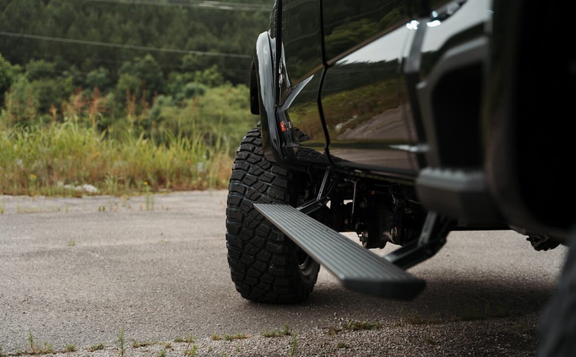 Right hand drive Black Widow F-250 Lariat Pickup truck from Autogroup International in Australia with powered side steps