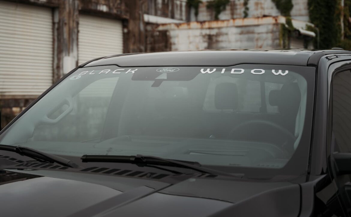 Right hand drive Black Widow F-250 Lariat Pickup truck from Autogroup International in Australia with iconic window badge