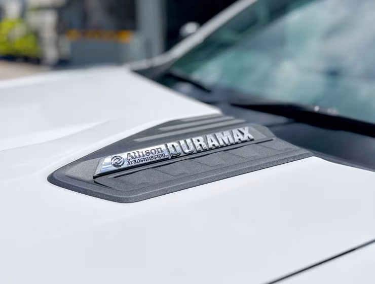 Right hand drive 2026 Chevrolet Silverado 3500 DRW High Country pickup truck from Autogroup International in Australia - Duramax logo on bonnet