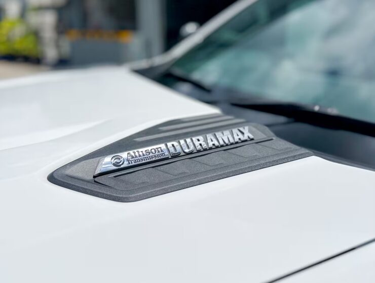 Right hand drive 2026 Chevrolet Silverado 3500 DRW High Country pickup truck from Autogroup International in Australia - Duramax logo on bonnet