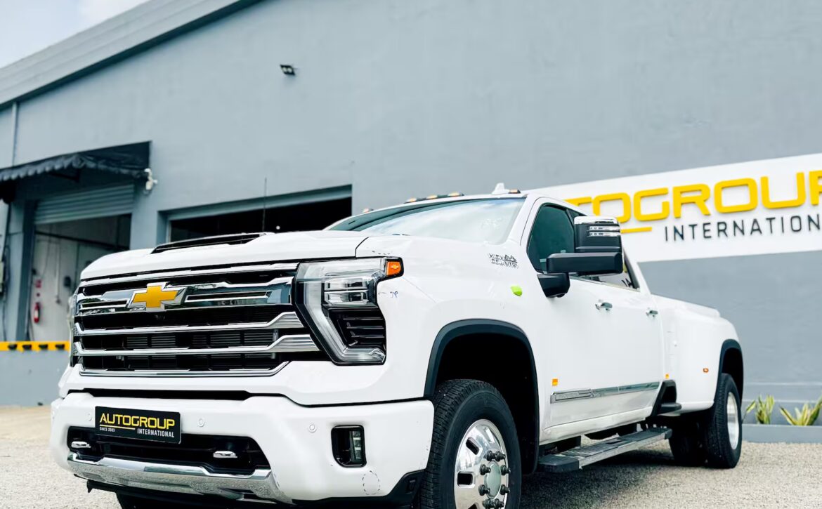 Right hand drive 2026 Chevrolet Silverado 3500 DRW High Country pickup truck from Autogroup International in Australia - front qtr view