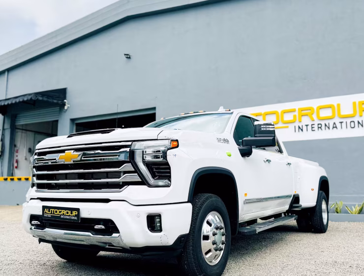 Right hand drive 2026 Chevrolet Silverado 3500 DRW High Country pickup truck from Autogroup International in Australia - front qtr view