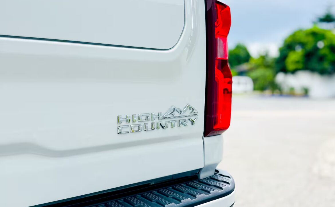 Right hand drive 2026 Chevrolet Silverado 3500 DRW High Country pickup truck from Autogroup International in Australia - High Country logo