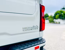 Right hand drive 2026 Chevrolet Silverado 3500 DRW High Country pickup truck from Autogroup International in Australia - High Country logo