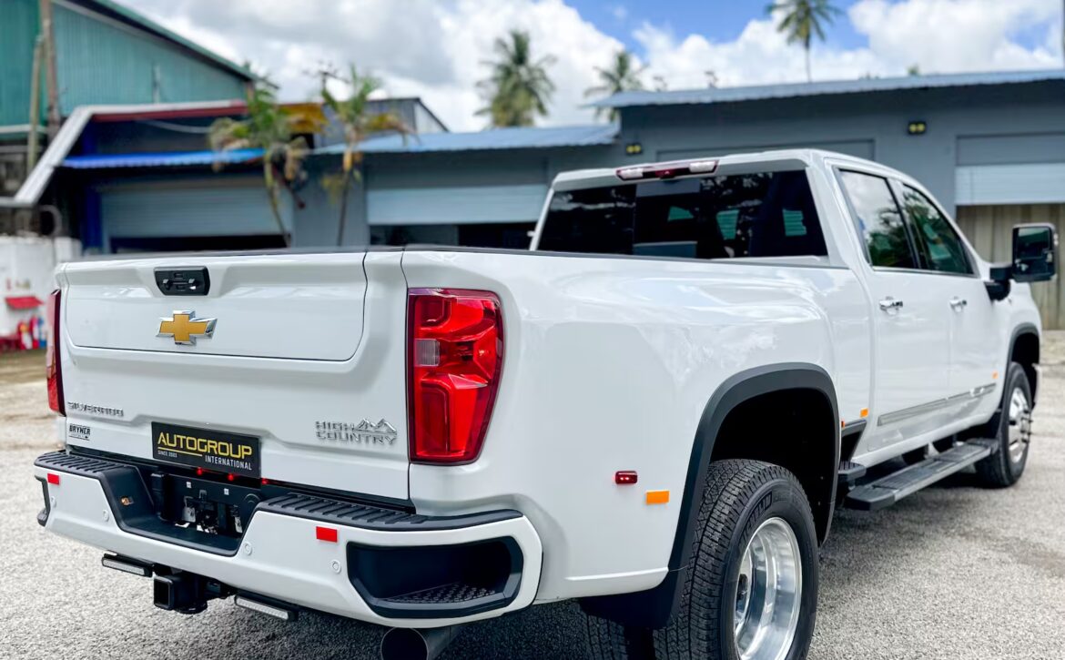 Right hand drive 2026 Chevrolet Silverado 3500 DRW High Country pickup truck from Autogroup International in Australia - rear qtr view