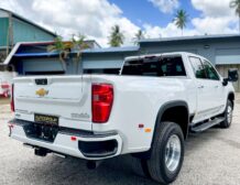 Right hand drive 2026 Chevrolet Silverado 3500 DRW High Country pickup truck from Autogroup International in Australia - rear qtr view