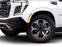 Right hand drive 2026 GMC Yukon XL AT4 Ultimate in Summit white from Autogroup International (front view)