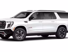 Right hand drive 2026 GMC Yukon XL AT4 Ultimate in Summit white from Autogroup International (front view)