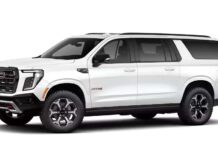 Right hand drive 2026 GMC Yukon XL AT4 Ultimate in Summit white from Autogroup International (front view)