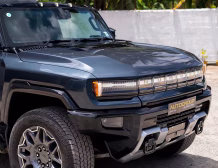 Right hand drive 2026 Hummer EV SUV 3X in Graphite Blue Metallic from Autogroup International - front quarter view