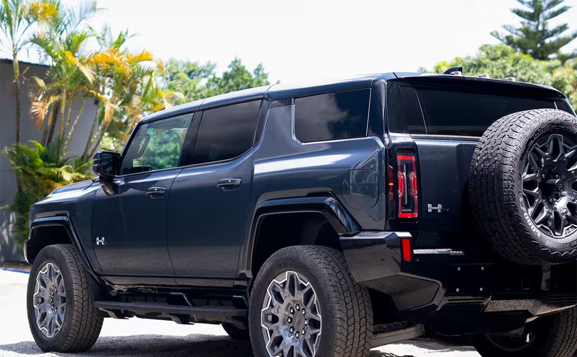 Right hand drive 2026 Hummer EV SUV 3X in Graphite Blue Metallic from Autogroup International - rear end view
