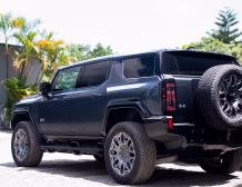 Right hand drive 2026 Hummer EV SUV 3X in Graphite Blue Metallic from Autogroup International - rear end view