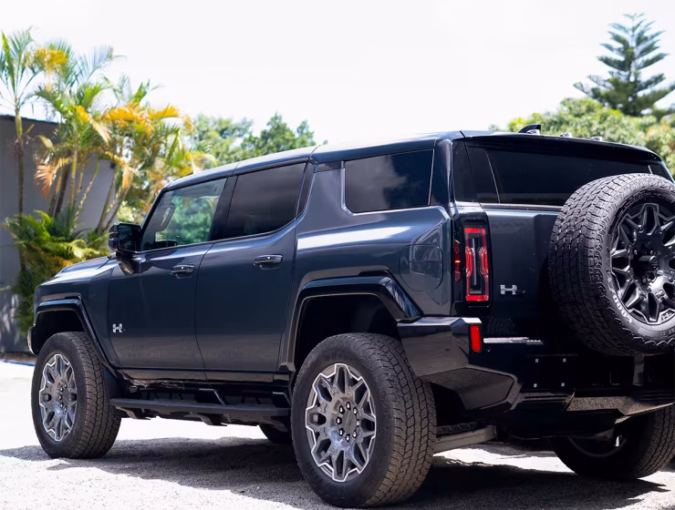 Right hand drive 2026 Hummer EV SUV 3X in Graphite Blue Metallic from Autogroup International - rear end view