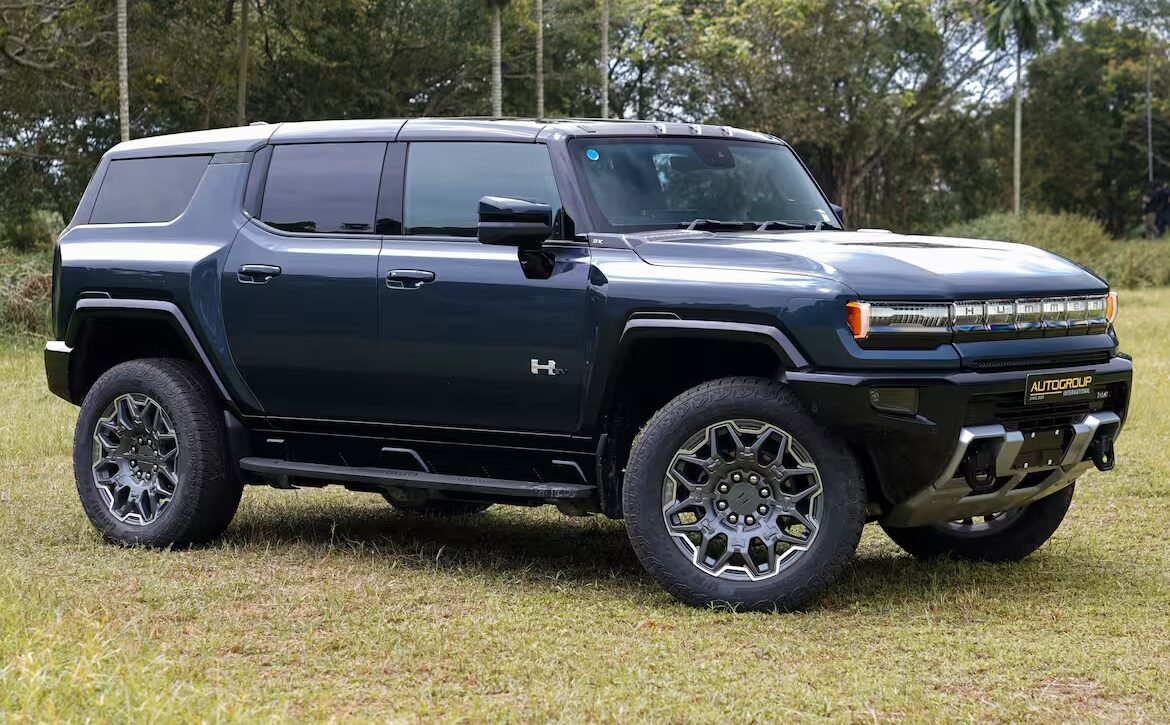 Right hand drive 2026 Hummer EV SUV 3X in Graphite Blue Metallic from Autogroup International - side view