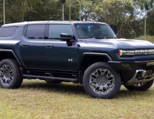 Right hand drive 2026 Hummer EV SUV 3X in Graphite Blue Metallic from Autogroup International - side view
