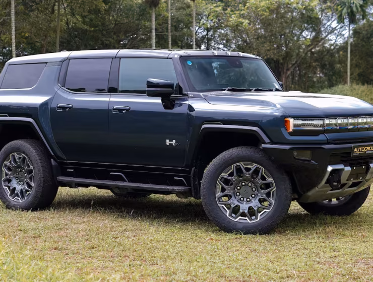 Right hand drive 2026 Hummer EV SUV 3X in Graphite Blue Metallic from Autogroup International - side view