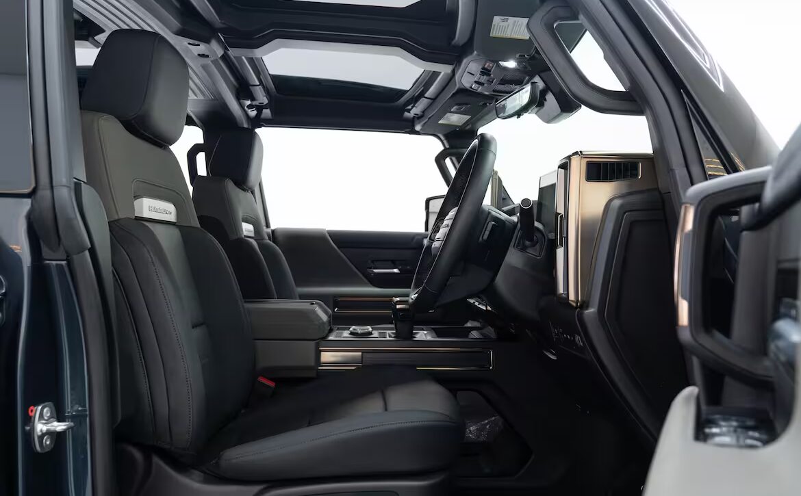 Right hand drive 2026 Hummer EV SUV 3X in Graphite Blue Metallic from Autogroup International - inside the front cabin