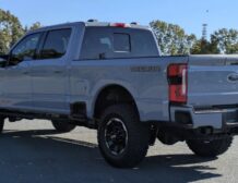 right hand drive 2026 ford super duty f 350 lariat tremor from autogroup international (rear back end qtr view) in australia