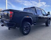 right hand drive 2026 gmc sierra 2500 hd at4x from autogroup international (rear qtr) in australia